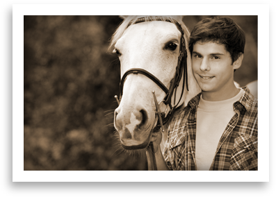 A teenage boy and a horse.